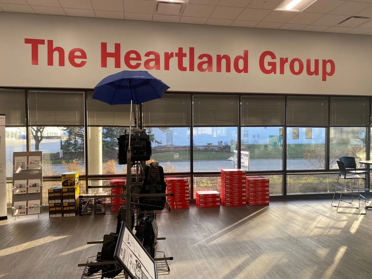 A large sign in front of a building that reads " the heartland group ".